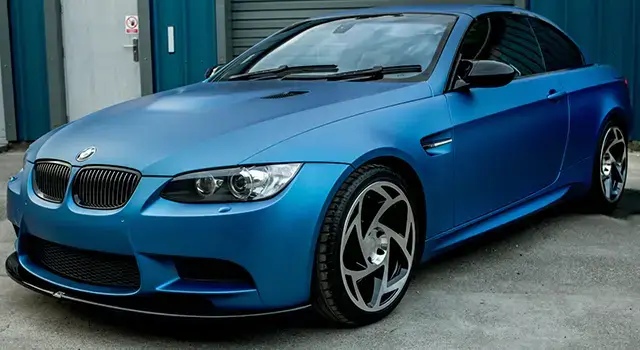 Matte finish on a BMW wrapped in blue. From MAch Speed car wraps